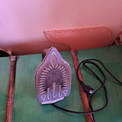 Steam iron used, as shown