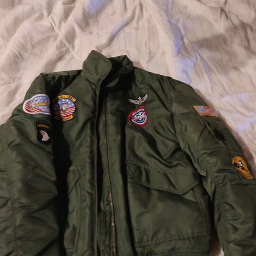 Flight jacket with embroidered patches like new, size 12