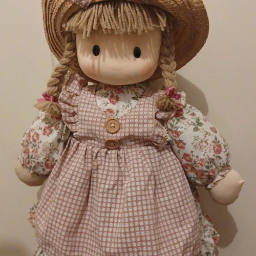 Doll like new with cotton clothes and straw hat