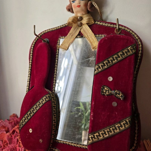 Antique mirror with velvet frame and doll, used 1950-1965