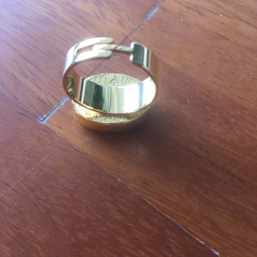 Faux ring like new, gold with black stone and adjustable size