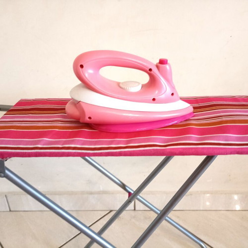 Toy ironing board with light-up iron that plays music like new