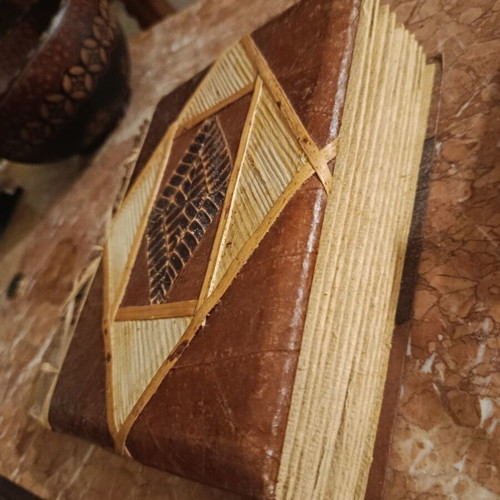 Handmade photo album with carved wooden details, vintage style