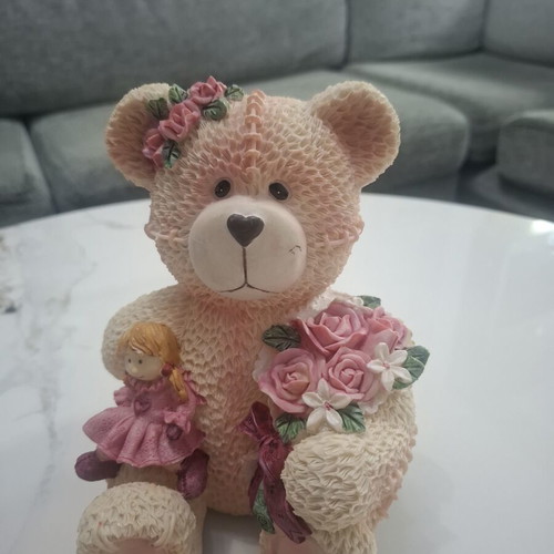 Collectible teddy bear with doll and roses, like new