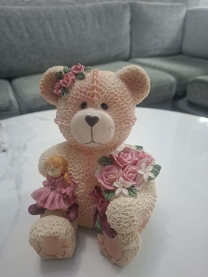 Collectible teddy bear with doll and roses, like new