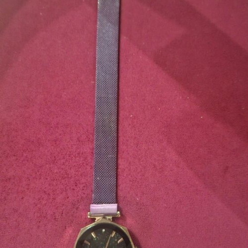 Wristwatch women's used with magnetic clasp purple color