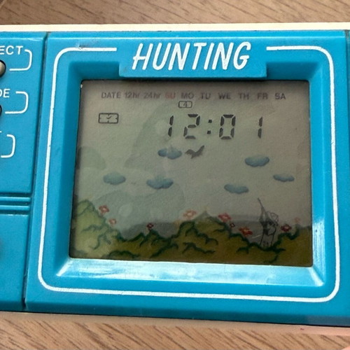 Mini retro arcade handheld console used without cover