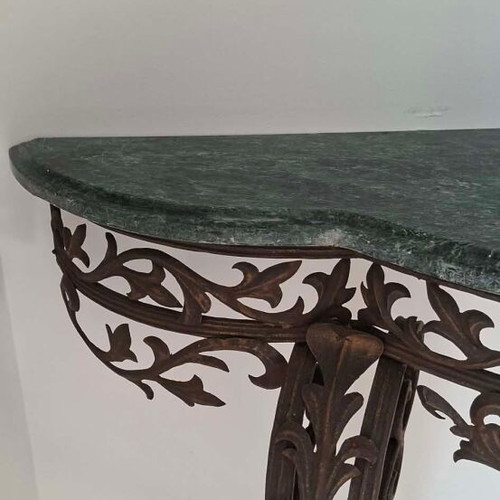 Metal console used with marble top and ornate wrought iron design