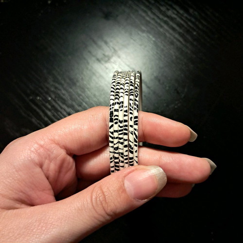 Set of black and white bracelets like new