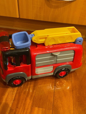 Fire truck used with sounds, lights, and folding ladder