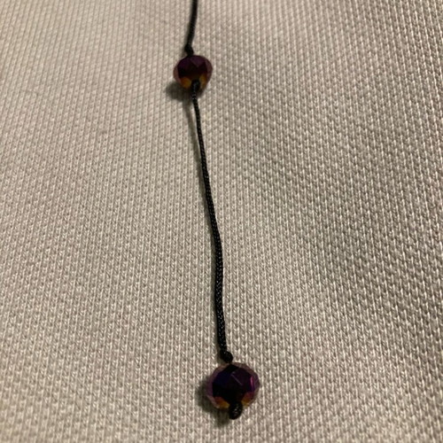 Necklace with purple beads like new, long with black cord