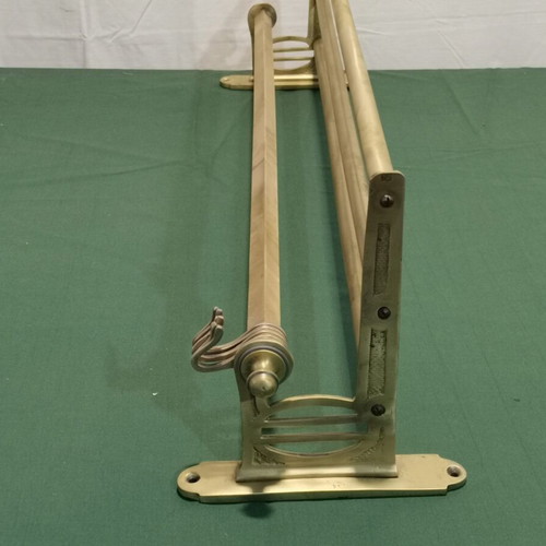 Brass wall-mounted hanger used