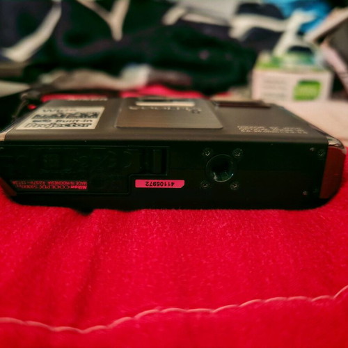 Nikon Coolpix S1000pj digital camera 12MP used with built-in projector