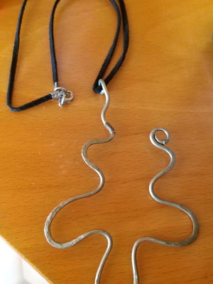 Necklace with hammered design and leather cord like new