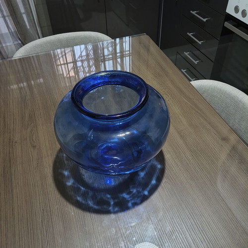 Blue glass vase, deep color and wide round shape