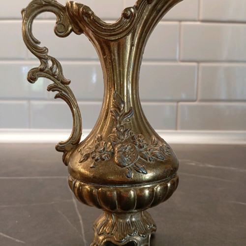 Metal container used with embossed design and handle