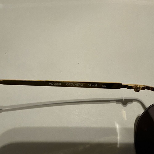 Vintage Vogue sunglasses with gold and black details, new