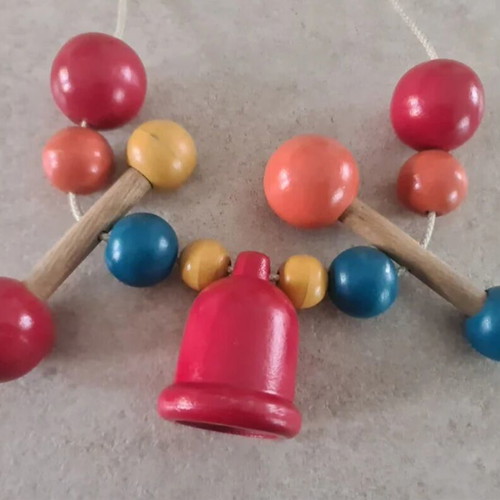 Vintage wooden stroller toy.