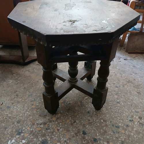 Vintage wooden table used, Victorian era with octagonal surface