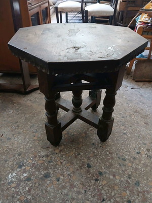 Vintage wooden table used, Victorian era with octagonal surface