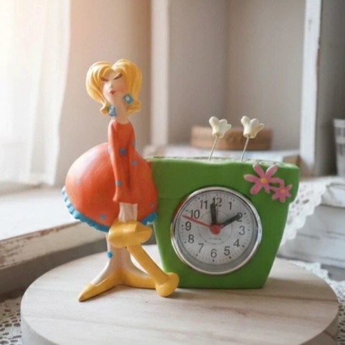 Table clock with female figure used, analog