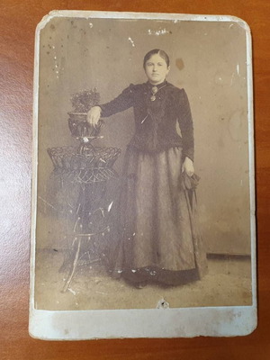 Thick cardboard photo of young woman, late 19th century