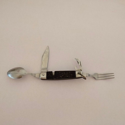 Vintage pocket knife with integrated fork and spoon, used