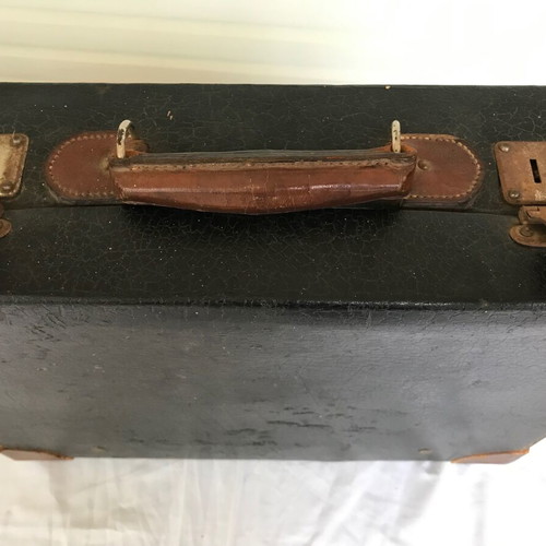 Small antique suitcase used with wear