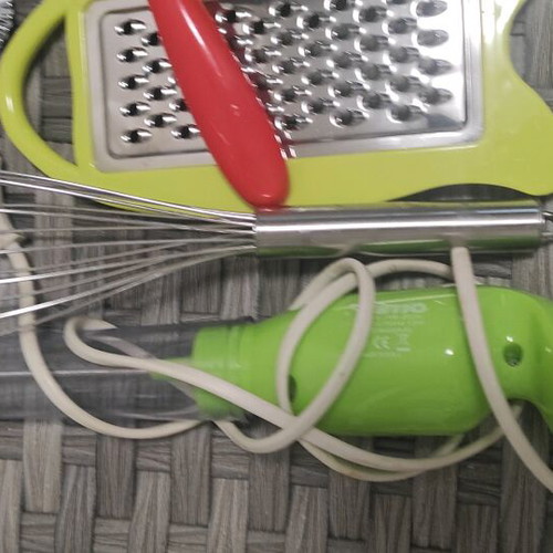 Kitchen tools set used with graters, peeler, whisk, and wire