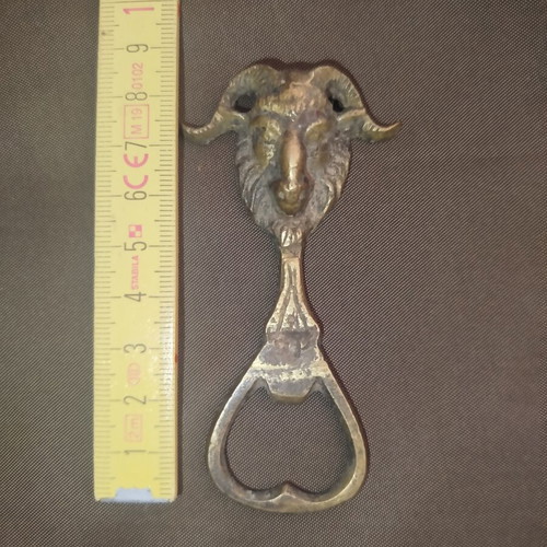 Bronze bottle opener used