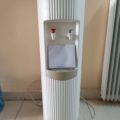 Water cooler used with 6 bottles for cold and hot water