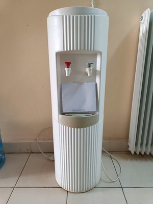 Water cooler used with 6 bottles for cold and hot water
