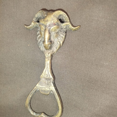 Bronze bottle opener used