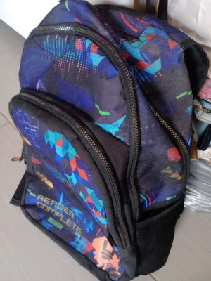 Unkeeper elementary school backpack with three compartments and two side pockets