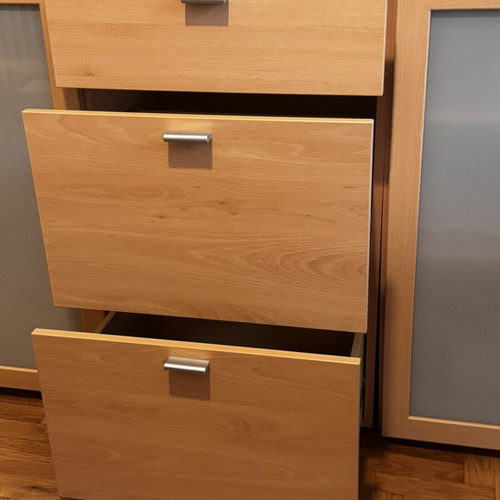 Wooden living room or bedroom furniture with drawers and cabinets