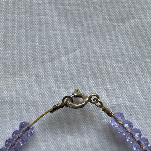 Lilac bracelet like new with beads and charms