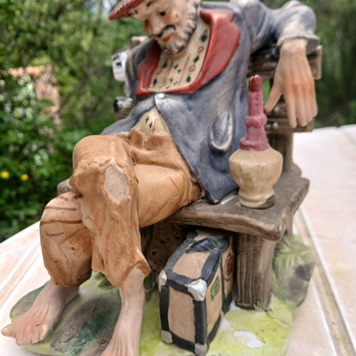 Traveler figurine used, missing one hand