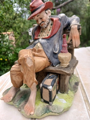 Traveler figurine used, missing one hand