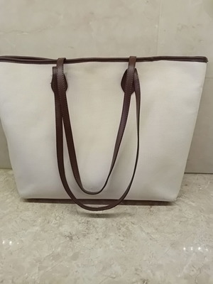 Large beige fabric shoulder bag with brown leather details