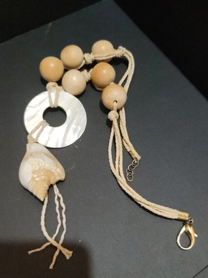 Handmade necklace with summer elements like new, white and beige