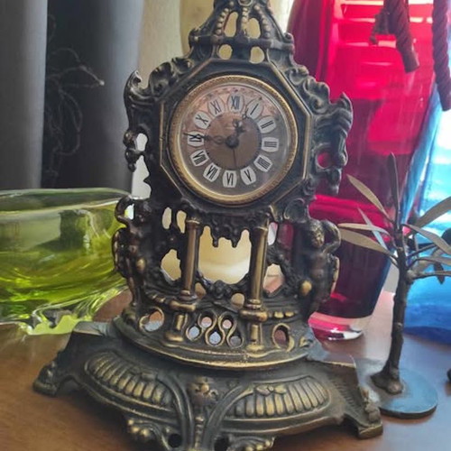Vintage baroque brass mechanical mantel clock.