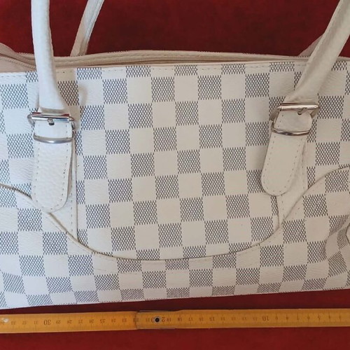 Vintage handbag like new with timeless checkered pattern