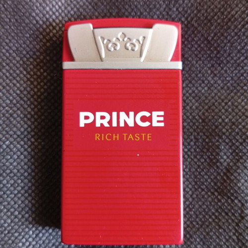 Prince lighter red metal promotional like new