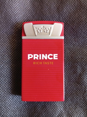 Prince μεταλλικός αναπτήρας κόκκινος προωθητικός σαν καινούργιο