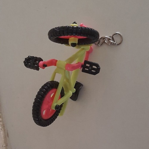 Vintage motorcycle and bicycle keychains used, colorful