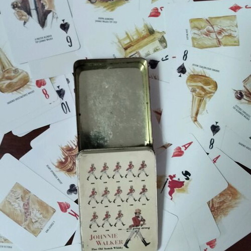 Johnnie Walker collectible playing cards laminated in metal box like new