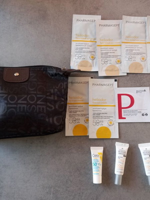 Makeup bag with new sunscreen samples CeraVe Pharmasept Heliocare