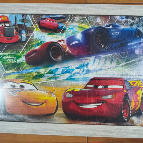 Children's puzzle in frame with extra puzzle