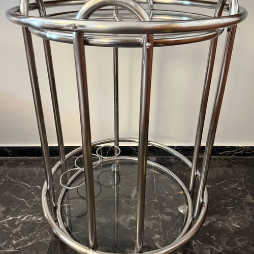 Vintage round trolley bar used with chrome tubular steel and glass shelves