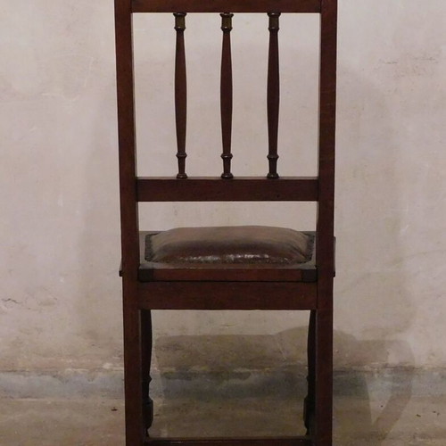 Wood-carved chairs with leather seat like new, set of 4